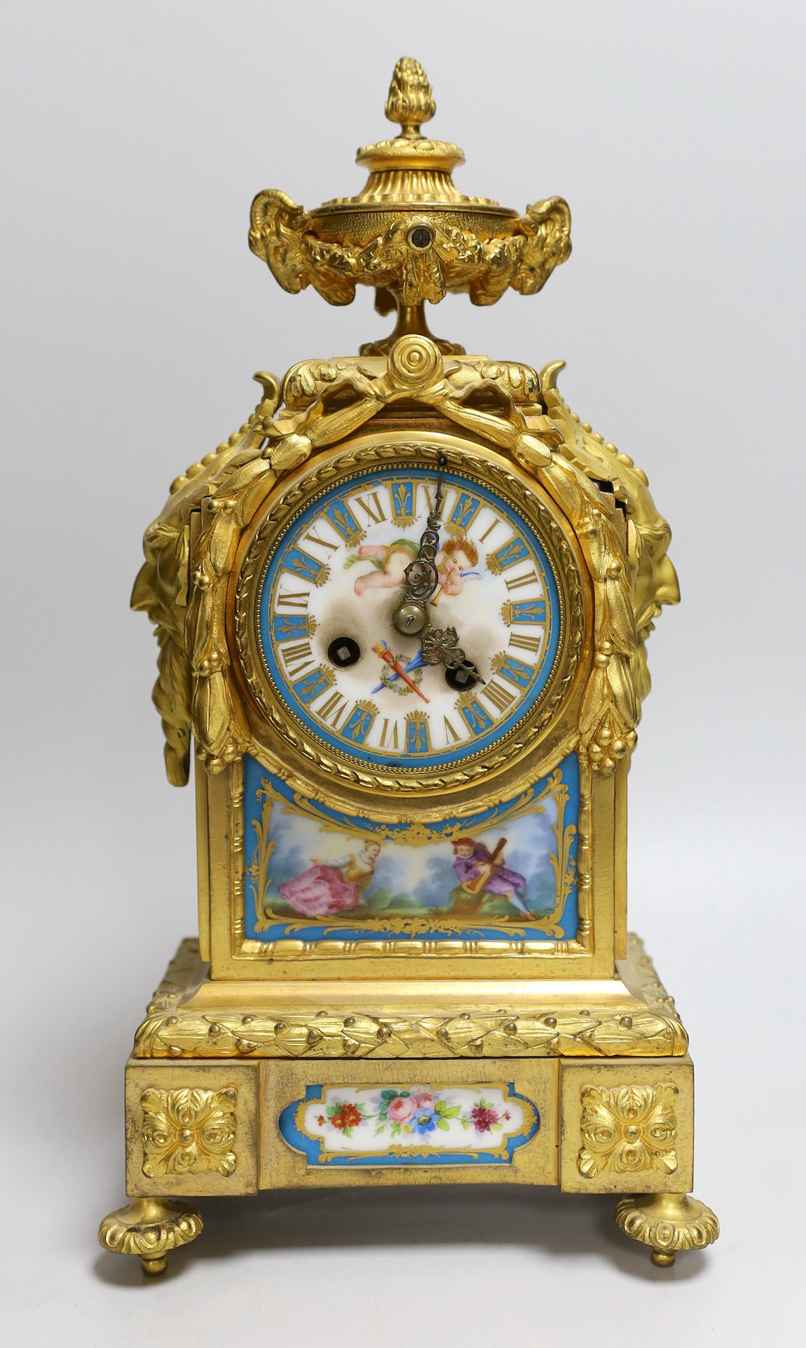 A 19th century French ormolu and Sevres style porcelain mounted mantel clock, 38cms high